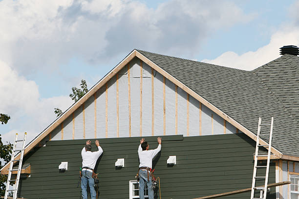 Professional Emergency Siding Repair technician working in Cable, OH